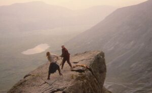 Connor and Ramirez from train on top of a mountain.